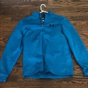 Under armour pull over in teal green. Never worn
